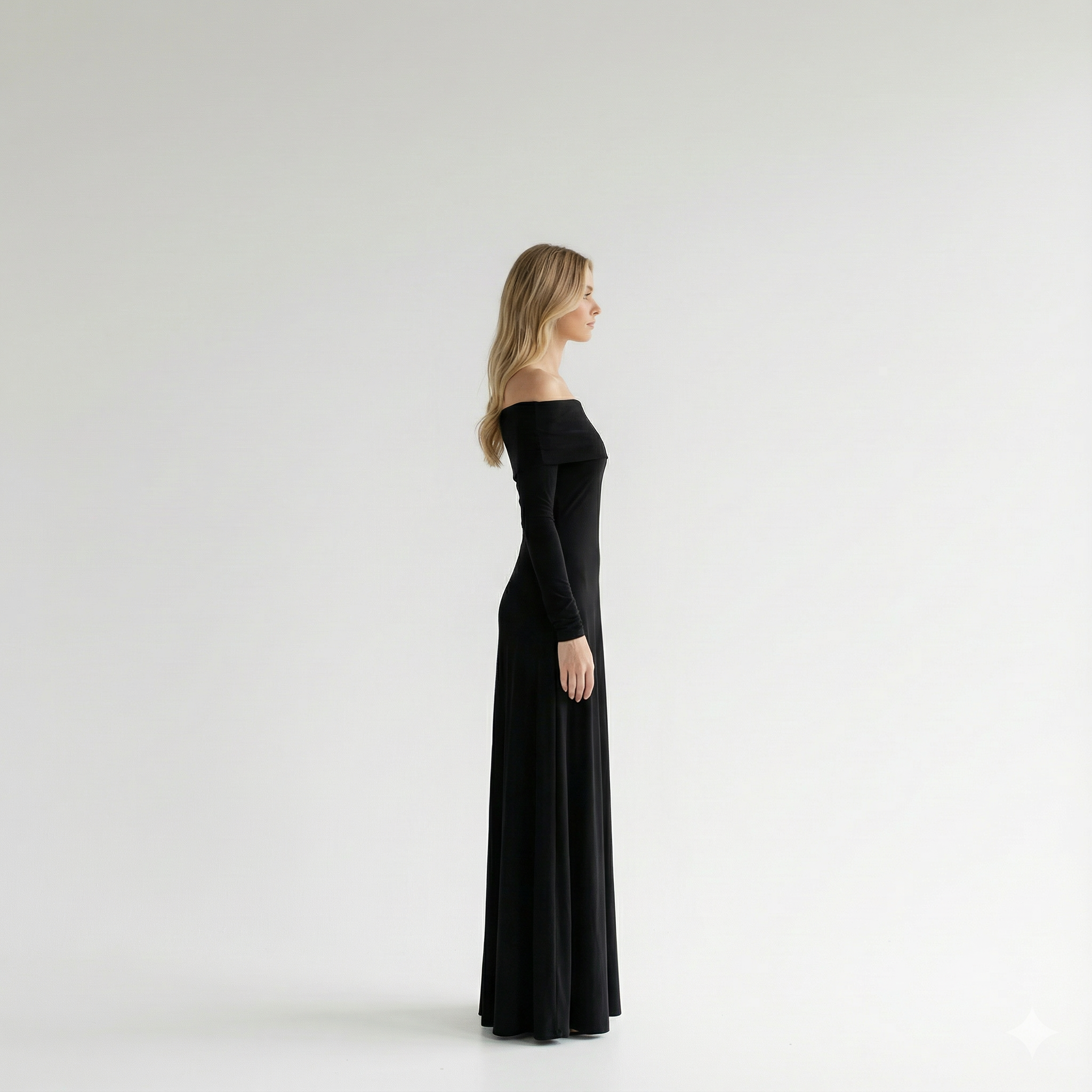 Woman wearing a black off-shoulder dress on a white background